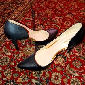 Black stilettos with a gold line.